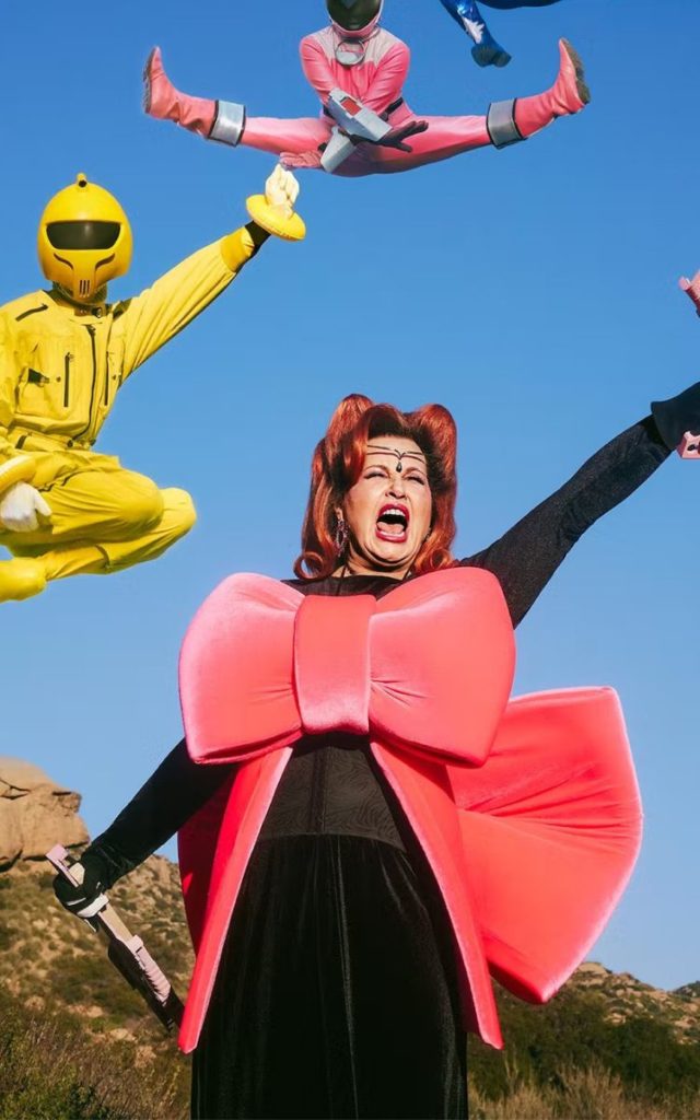 Jennifer Coolidge with red hair and power rangerson the cover of W Magazine